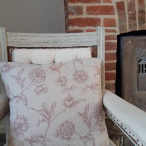 Pastel pink floral cushion